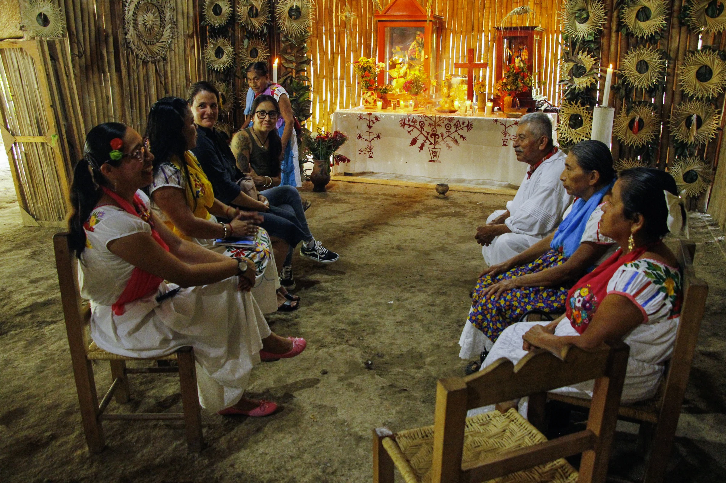 Totonac teachers and knowledge holders sit together in a meeting at the Centre for Indigenous Arts.